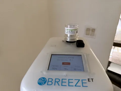 Calibrated Breeze air-sampling pump collecting a mold air sample for laboratory analysis