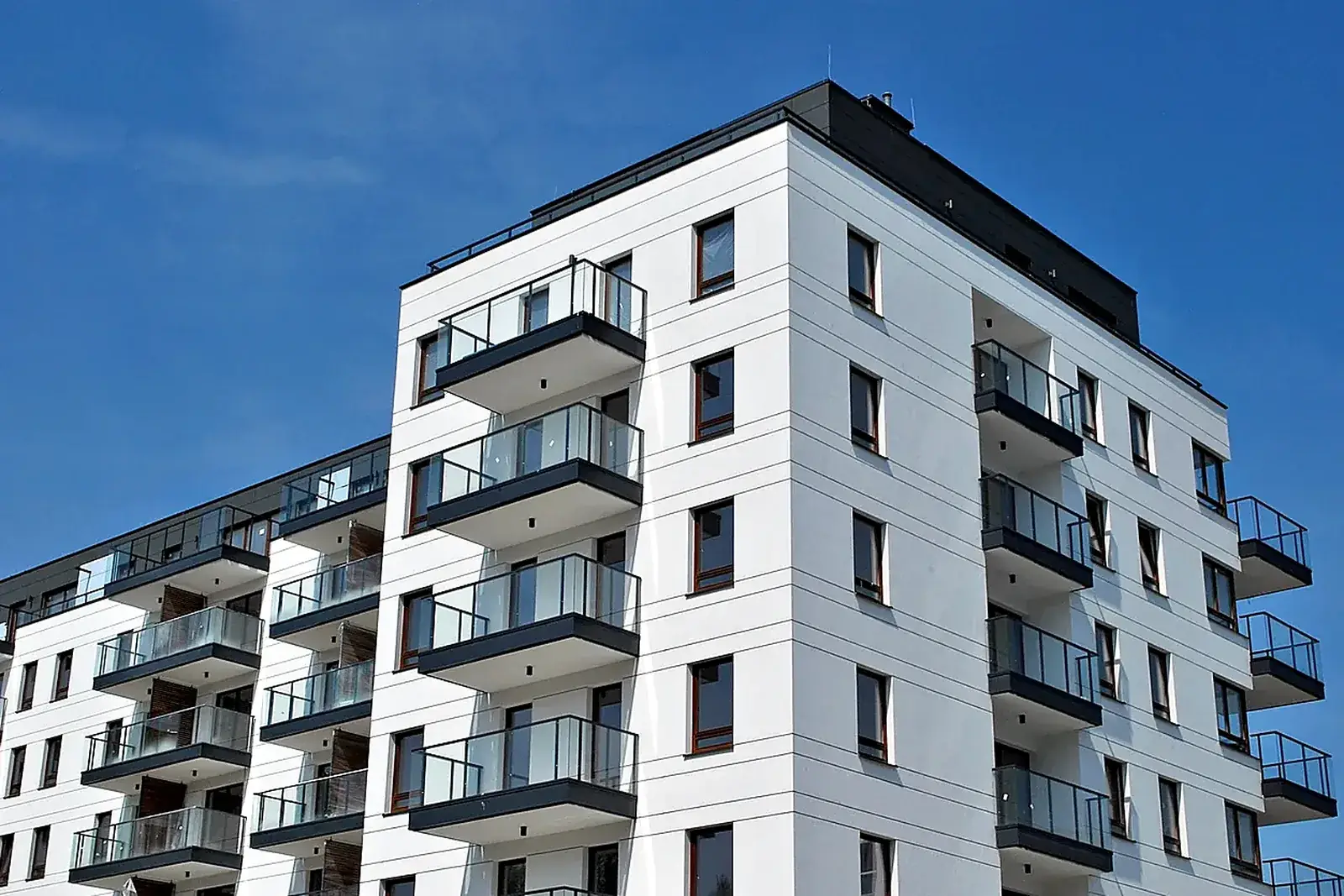 Modern multi-family apartment building with balconies, representative of the Pinellas County tenant-occupied