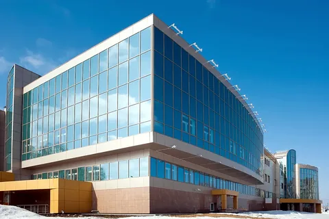Glass-and-steel commercial building exterior assessed during a commercial mold inspection