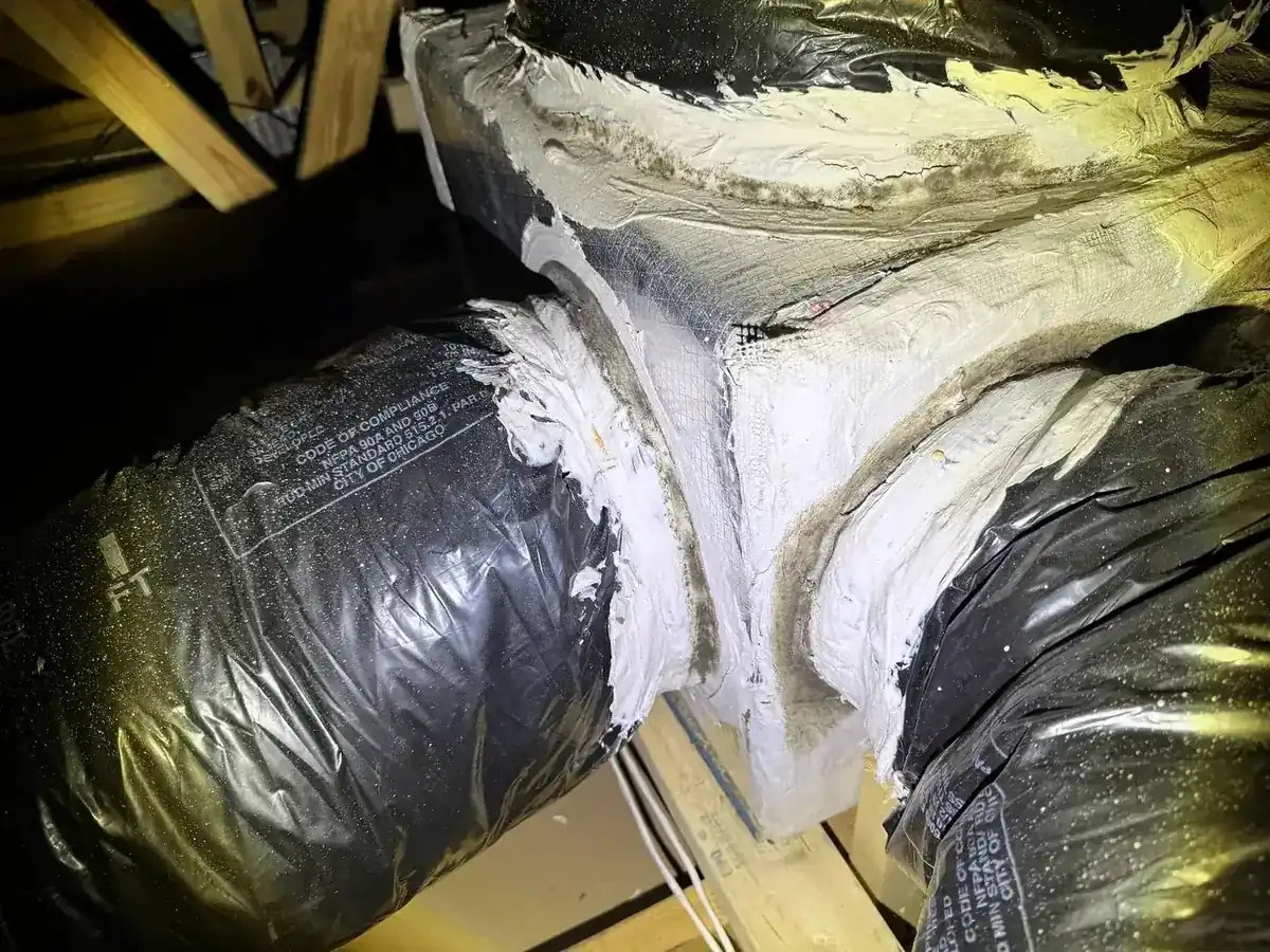 Mold growth around attic duct connections observed during a PureSpec property inspection