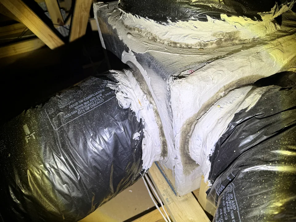 Mold growth around attic duct connections observed during a PureSpec property inspection